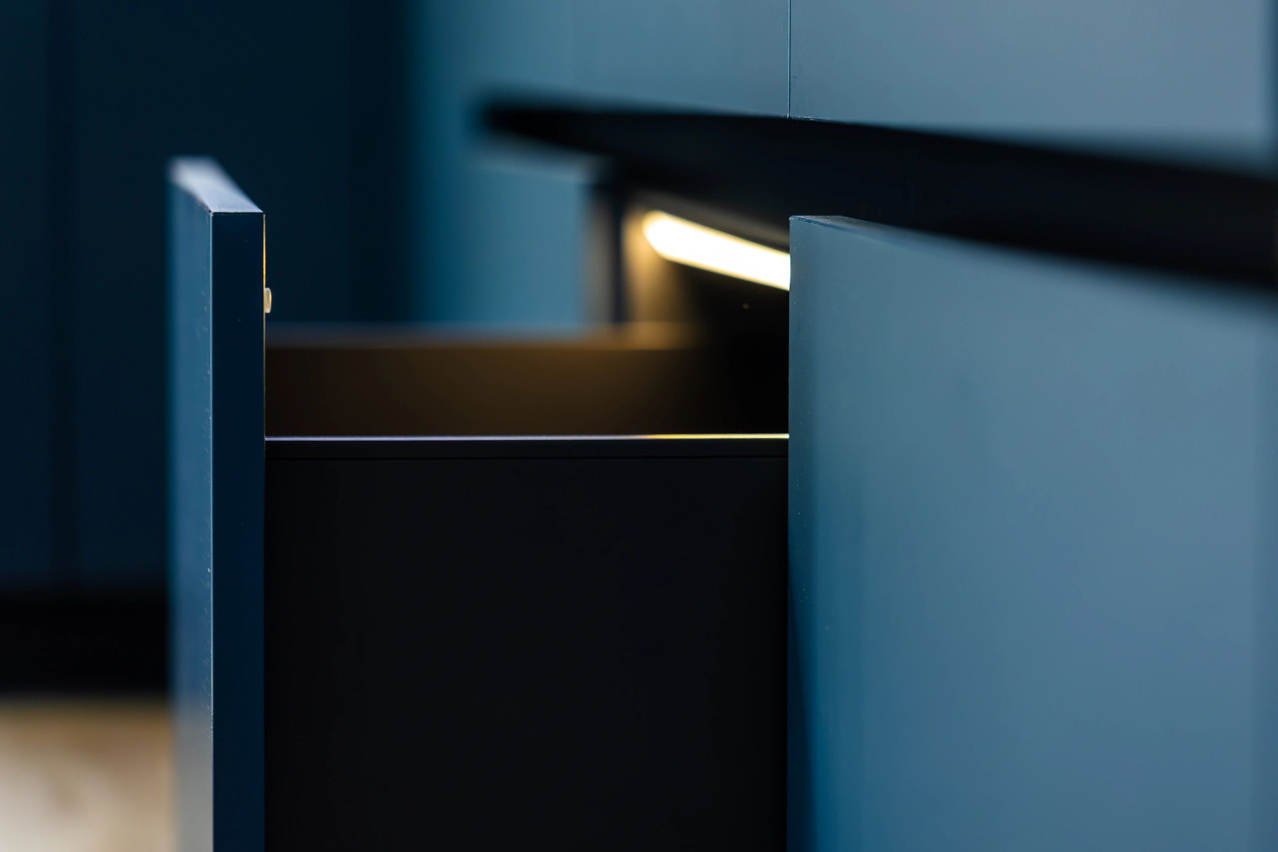 Modern kitchen joinery detail with warm lighting